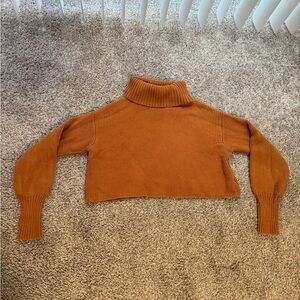 Brownish orange cropped turtleneck sweater